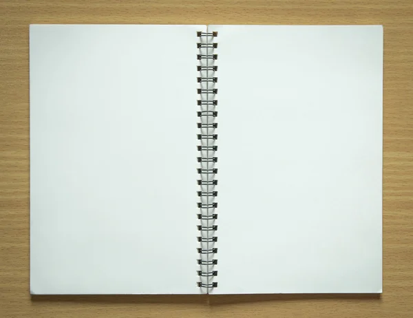 Blank spiral notepad on wood background — Stock Photo, Image