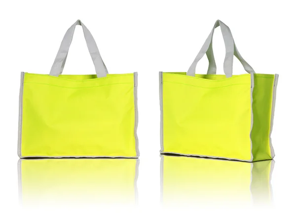 Beyaz zemin üzerine sarı alışveriş çantası — Stok fotoğraf