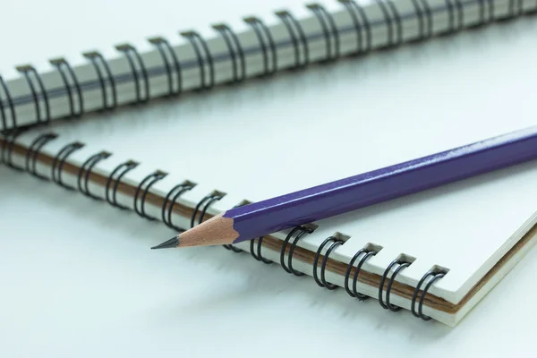 Close up pencil and spiral notebook — Stock Photo, Image
