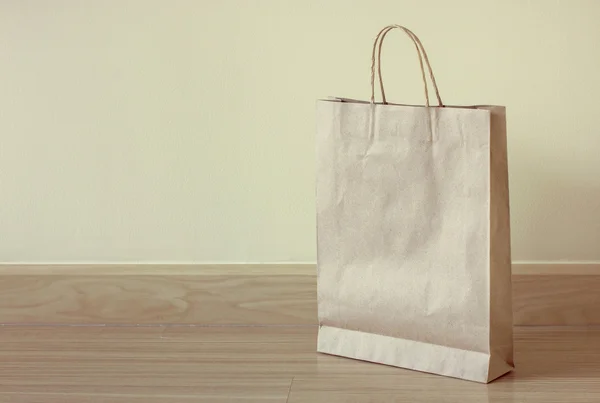 Brown paper bag on the floor — Stock Photo, Image
