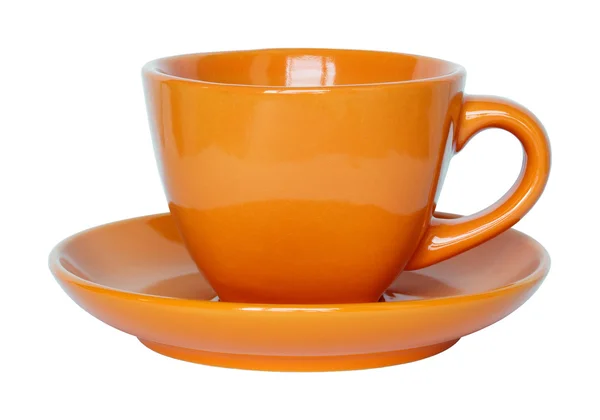 Prázdné oranžové šálek a talířek izolovaných na bílém s ořezovou cestou — Stock fotografie