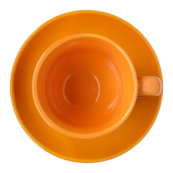 Empty orange cup and saucer top view isolated on white — Stock Photo, Image