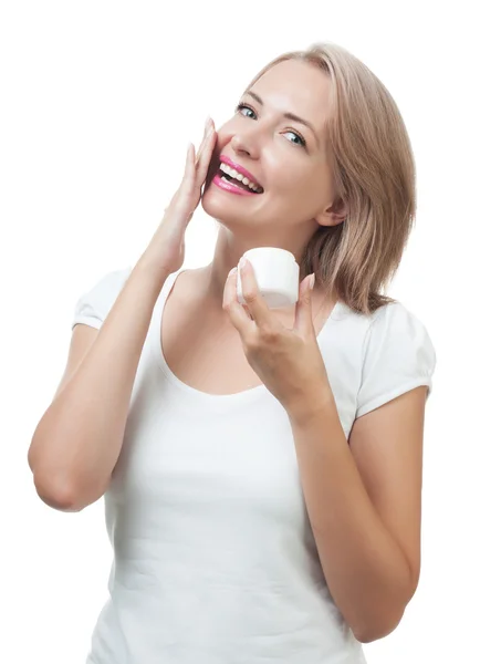 Beautiful woman gets cream on face isolated on white — Stock Photo, Image