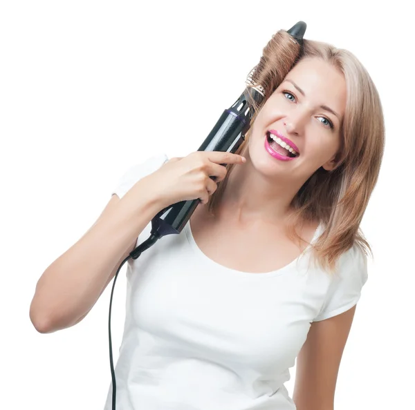 Beautiful girl doing hairstyle with hair brush Royalty Free Stock Photos