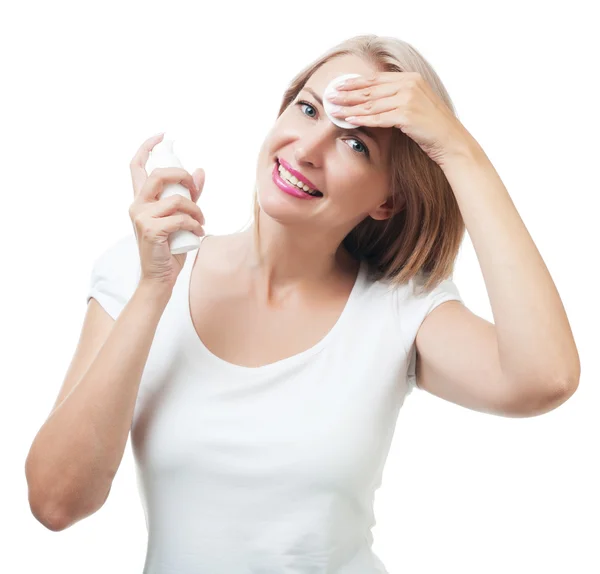 Woman removes makeup sponge isolated on white background — Stock Photo, Image