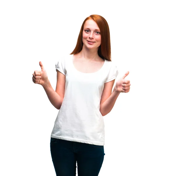 Red-haired girl showing thumbs up. Isolated on white background — Stock Photo, Image