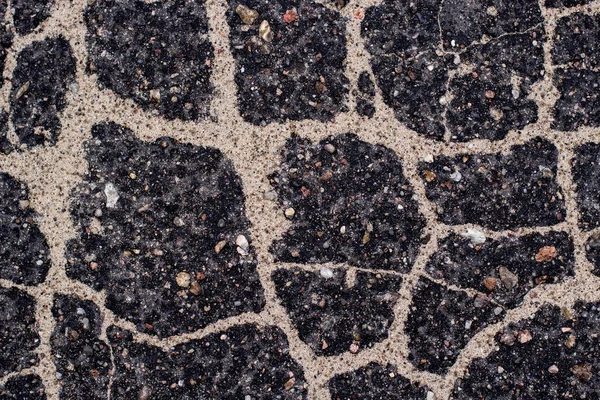 Old asphalt with stones. — Stock Photo, Image