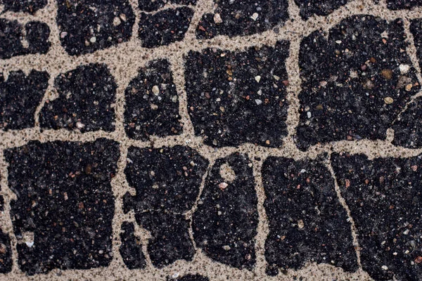 Old asphalt with stones. — Stock Photo, Image