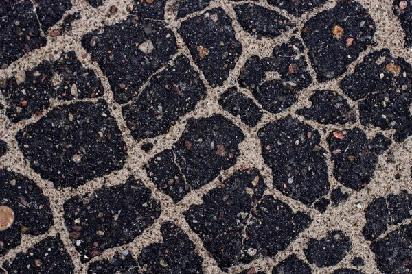 Old asphalt with stones. — Stock Photo, Image