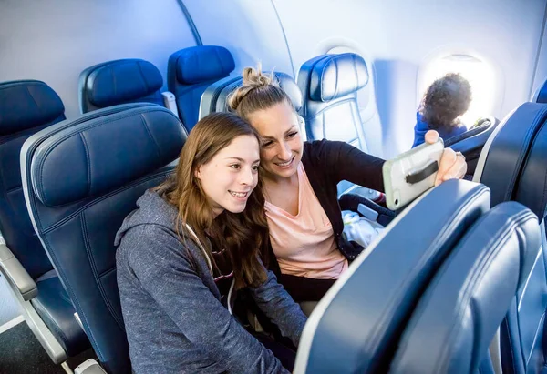 Two Women Taking Selfie Together While Traveling Airplane Mother Daughter — Stock Photo, Image