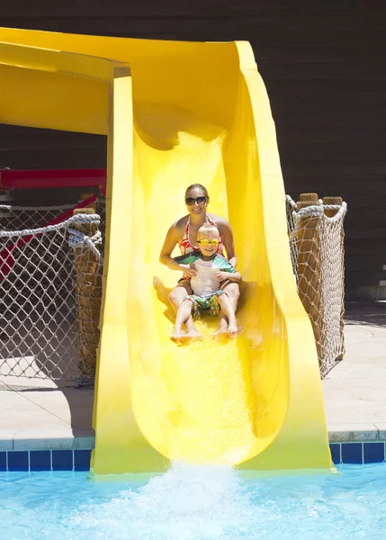 Fun on the water slide at waterpark — Stock Photo, Image