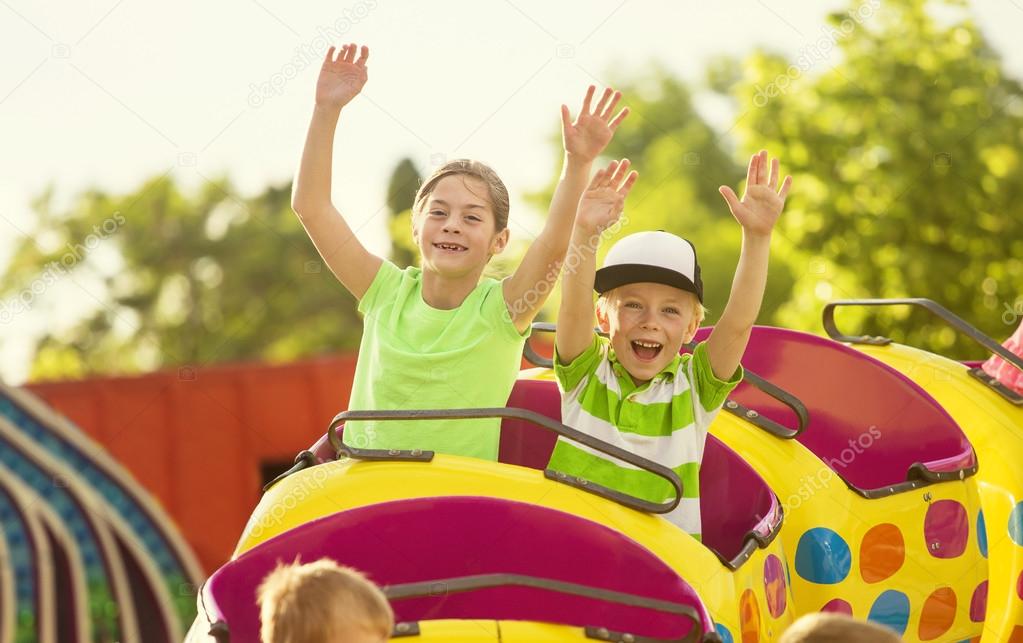 Boy and Girl on a thrilling roller coaster