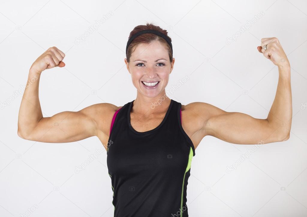 Woman flexing her muscles Stock Photo by ©yobro10 77036873
