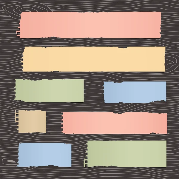 Conjunto de peças rasgadas papel notebook colorido são colados na parede de madeira escura ou mesa —  Vetores de Stock