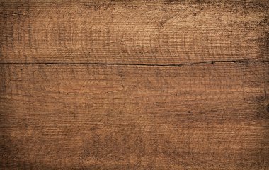 Koyu kahverengi çizik ahşap kesim tahtası. Ahşap doku