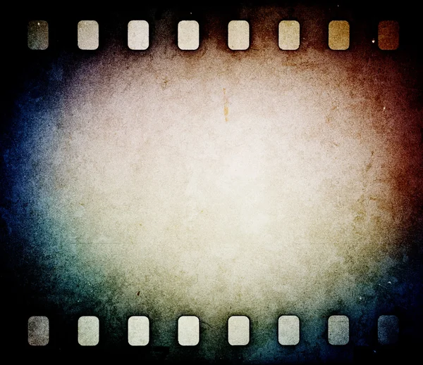 Grunge scratched film strip background — Stock Photo, Image