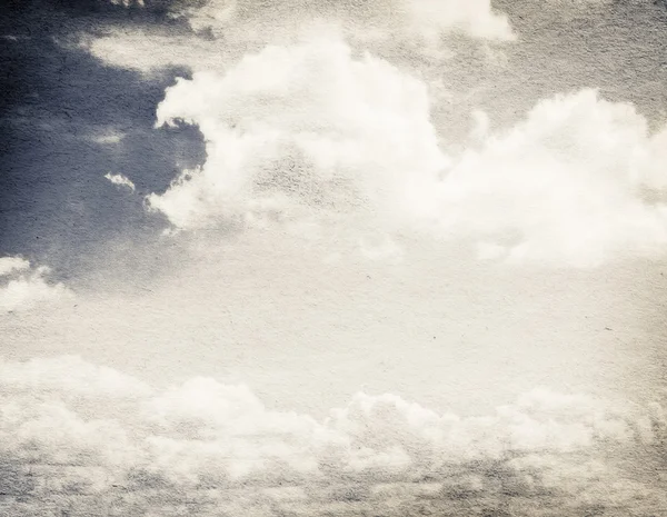 Wolken und Himmel auf körnigem Papier. — Stockfoto