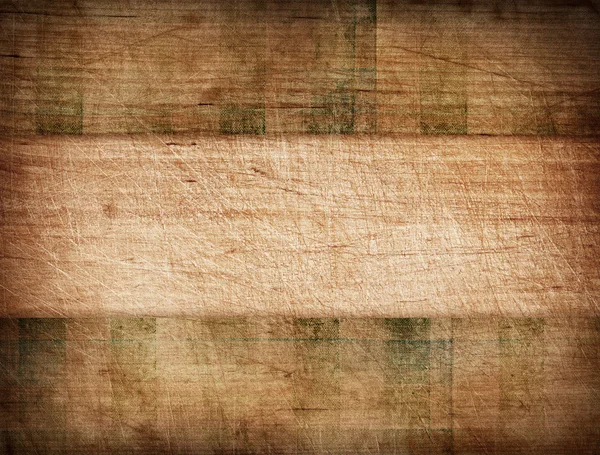 Grunge pruhovaný ubrus na dřevěné prkénko — Stock fotografie