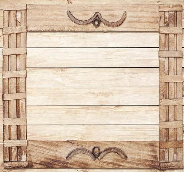 Square ornate wooden frame on wood background — Stock Photo, Image