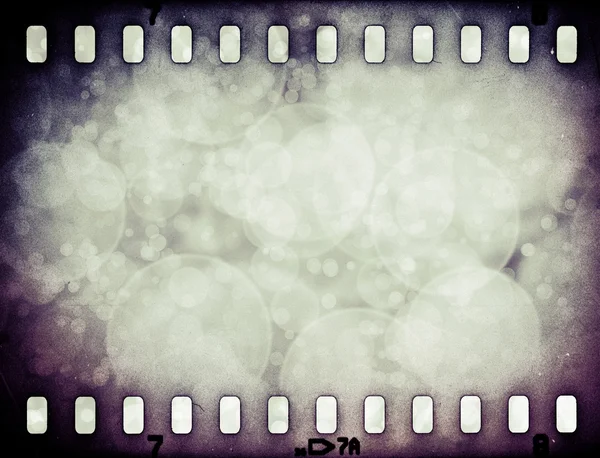 Grunge arranhado tira de filme colorido com estrelas de fundo — Fotografia de Stock