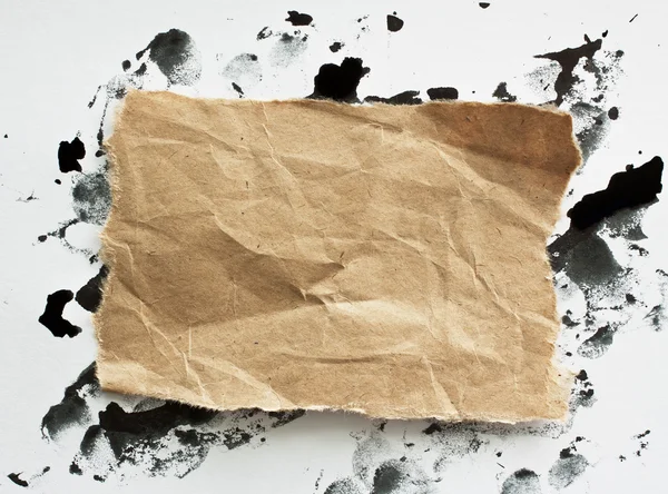 Torn brown note papers on white background — Stock Photo, Image