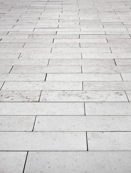 Grey brick stone street road. Light sidewalk, pavement texture — Stock Photo, Image