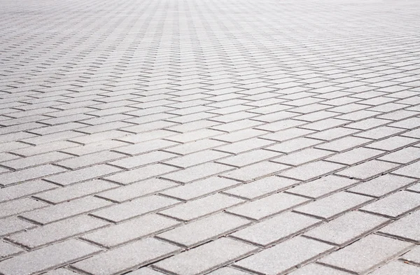 Grey brick stone street road. Light sidewalk, pavement texture — Stock Photo, Image