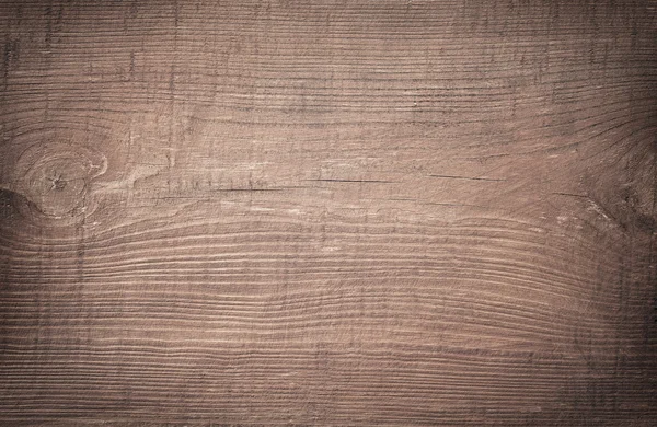 Brown scratched wooden cutting board. — Stock Photo, Image