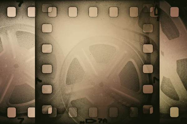 Grunge old motion picture reel with film strip. Vintage background — Stock Photo, Image