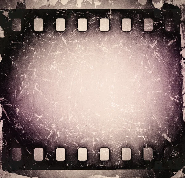 Grunge old scratched film strip. Vintage background — Stock Photo, Image