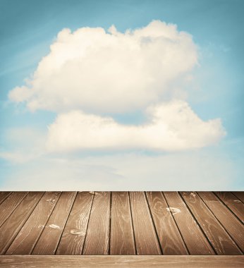 Bulutlar ve ahşap zemin arka plan ile güneşli gökyüzü