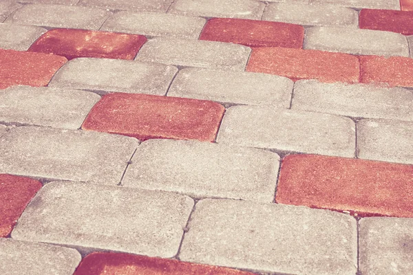 Red brick stone street road. Light sidewalk, pavement texture — Stock Photo, Image