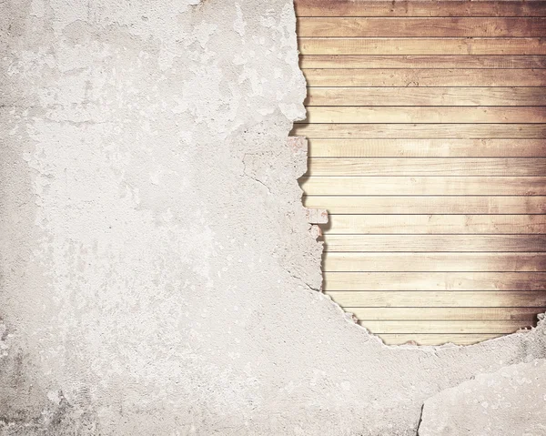 Old cracked concrete wall with brown wooden planks — Stock Photo, Image