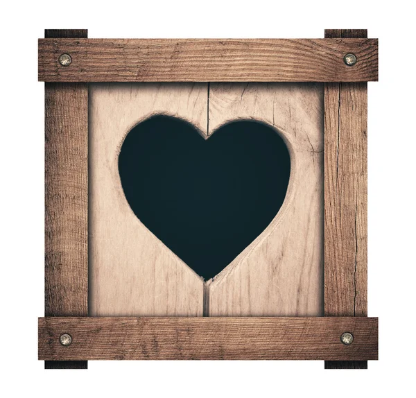 Forma do coração cortado em tábuas de madeira e quadro parafusado — Fotografia de Stock
