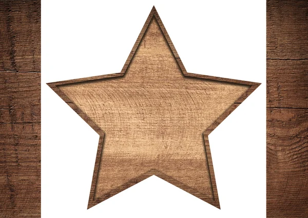 Hnědá dřevěná hvězda s rámem mezi tmavě prkna — Stock fotografie