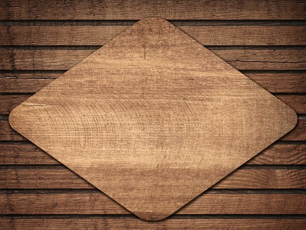 Losange en bois marron avec ombre sur le mur des planches — Photo