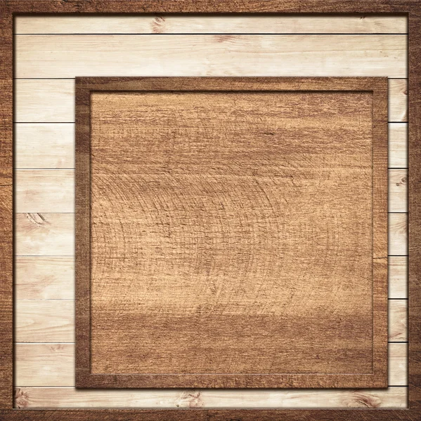 Brown wooden frame screwed on light wall planks — Stock Photo, Image