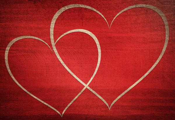 Red wooden background with white heart shape — Stock Photo, Image