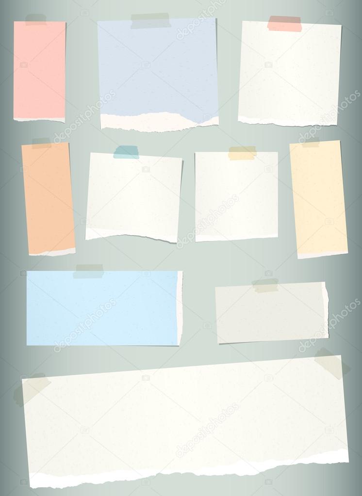 Pieces of torn colorful blank note paper on gray background