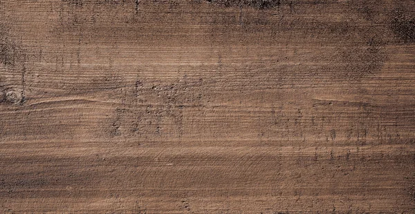 Tabla de cortar de madera rayada marrón oscuro. Textura madera —  Fotos de Stock