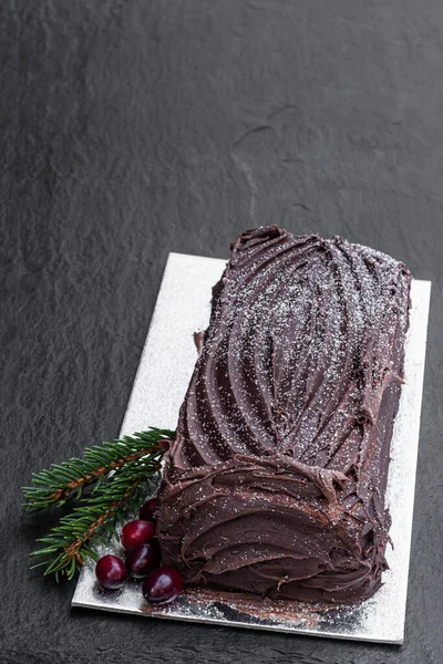 Christmas Yule Log Cake Chocolate Cream Cranberry Black Stone Background — Stock Photo, Image