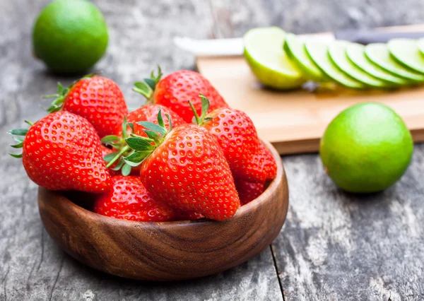 Fresh strawberry and lime on the table — Stock Photo, Image