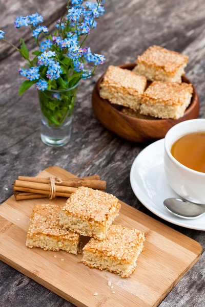 Homemade sesame cookies with cup of tea — Stock Photo, Image