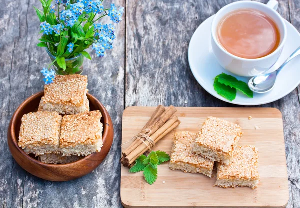 Homemade sesame cookies with cup of tea — Stock Photo, Image