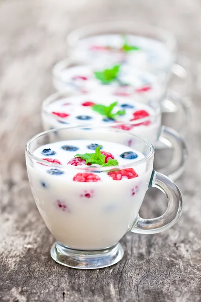 Fresh milk with berries on the table — Stock Photo, Image