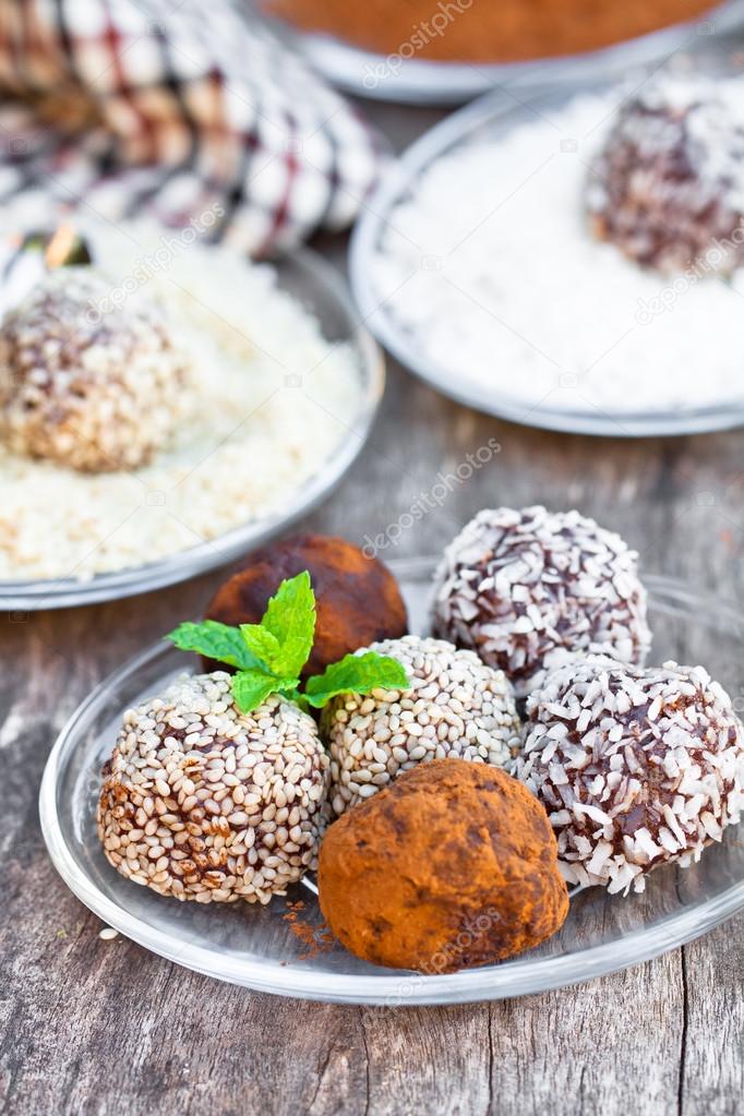 Assorted dark chocolate truffles with cocoa powder and coconut a