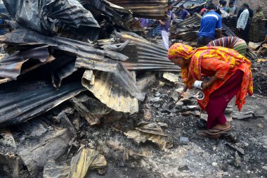 Bangladeshi Slum-dwellers have seen searching for their household belongings after a devastating fire that broke out at Mohakhali slum in Dhaka, Bangladesh, on June 7, 2021. At least 300 shanties were gutted as the devastating fire that broke out at  clipart