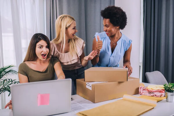 Sales online.Three young  women helped sell their products online and happily prepared to delivery their products. Selling products online or doing freelance work at home concept.