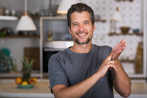 Young man showing gesture in sign language