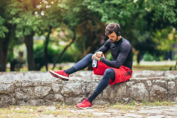 Young Sportsman Listening Music While Doing Exercising Park Fitness Sport — Stock Photo, Image